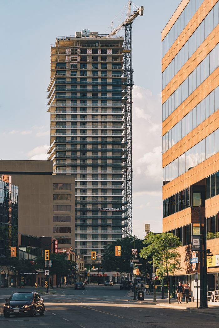 Modern high-rise construction in downtown London, Ontario on a sunny day.